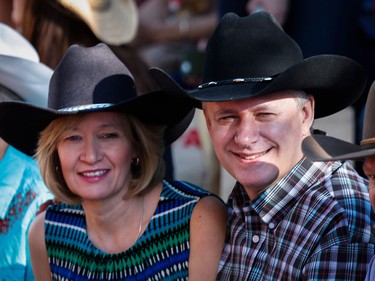 Prime Minister Stephen Harper and his wife Laureen look on during the Calgary Stampede parade in Calgary, Friday, July 3.