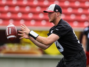 Calgary Stampeders quarterback Bo Levi Mitchell catches the snap during practice at McMahon Stadium on Monday.