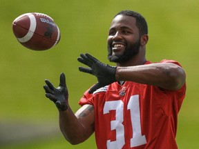 Calgary Stampeders linebacker Jasper Simmons receives a toss during practice earlier this week.