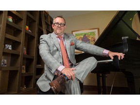 Greg Shannon at home in his parlour with his piano.