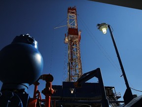 An oil derrick operated by Raven Drilling drills for oil in the Bakken shale formation outside Watford City, North Dakota.