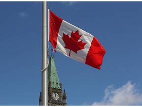 The flag above the Peace Tower, and other buildings on Parliament Hill, flies at half staff marking the National Day of Remembrance for Victims of Terrorism in Ottawa Tuesday, June 23, 2015. .THE CANADIAN PRESS/Fred Chartrand