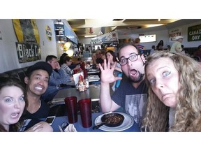 The staff of the Common Ground Festival, which kicks off in Calgary July 22, brainstorm at a Calgary cafe. L to R: Emma Slunt, John Iglesias, Troy Couillard and Lisa Floyd. Photo courtesy Troy Couillard.