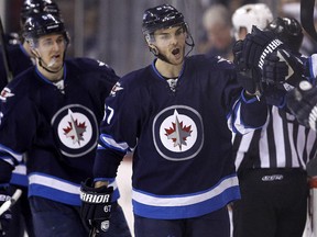 The Flames signed former Winnipeg Jets right-winger Michael Frolik to a five-year, $21.5-million deal on the first day of free agency Wednesday.