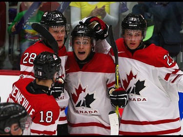 Team Canada celebrates scoring in the opening game of the World's Junior Showcase at the Markin MacPhail Centre in Calgary on Monday, Aug. 3, 2015. Team Canada was tied with Team Russia, 1-1, at the end of the first period.