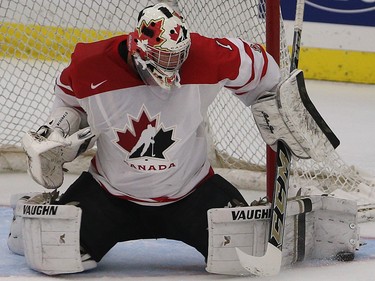 Team Canada goalie Mason McDonald blocks the puck in the opening game of the World's Junior Showcase at the Markin MacPhail Centre in Calgary on Monday, Aug. 3, 2015. Team Canada was tied with Team Russia, 1-1, at the end of the first period.