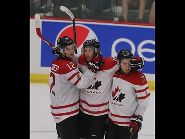 Team Canada celebrates their fourth goal on net in the opening game of the World's Junior Showcase at the Markin MacPhail Centre in Calgary on Monday, Aug. 3, 2015. Team Canada won over Team Russia, 4-1.