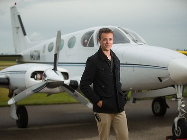 Andrew Brice, captain and pilot for Weather Modification Inc., stands in front of a Cessna 340 used for cloud seeding to prevent hail, at the Olds Airport on Thursday, Aug. 6, 2015.