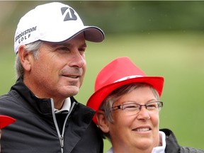 Champions Tour golfer and last year's Shaw Charity Classic winner Fred Couples stopped for a quick photograph with fan Margie Davidson from Fort Saskatchewan before he teed off on the 8th hole on the course at the Canyon Meadows Golf Club during a damp second day of ProAm competition on August 6, 2015. Davidson said meeting Couples was on her bucket list.