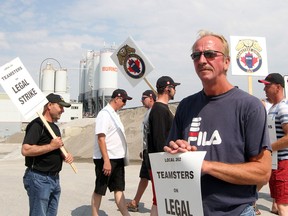 Jim Carlson is a mixer driver for over 26 years with Burnco, and is forced to strike after Burnco closed their doors, in Calgary on August 10, 2015.