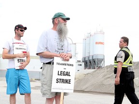 Burnco employees on strike after they showed up to work to find the doors locked, in Calgary on August 10, 2015.