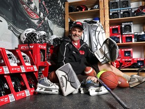 Russell Gillespie, manager with Comrie's Sports Equipment Bank, helps kids in need play sports by providing them with free gear, in Calgary on August 10, 2015.