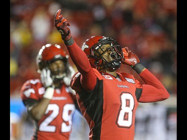 Calgary Stampeders defensive back Fred Bennett, centre, lets out a cheer after the Ottawa Redblacks field goal attempt is foiled by a kick into a post at McMahon Stadium in Calgary on Saturday, Aug. 15, 2015. The Calgary Stampeders won over the Ottawa Redblacks, 48-3, in regular season CFL play.