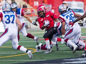 Calgary Stampeders running Back Tim Brown dodges a tackle during Saturday's 25-22 victory over the Montreal Alouettes.