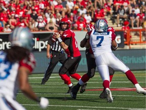 Quarterback Bo Levi Mitchell throws a pass as the Stampeders go on to win 25-22 at McMahon Stadium on Aug. 1. Reader says heavy-handed officials are spoiling the games with too many penalties.