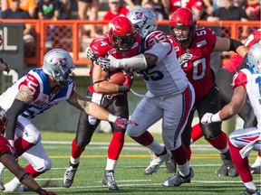 Running Back Walter Matt pushes through a tackle as the Stampeders win 25-22 at McMahon Stadium on August 1st, 2015.