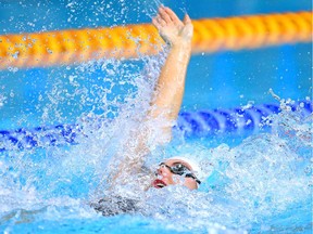 Calgary's Brooklynn Snodgrass, seen competing at the 2014 Commonwealth Games, led the Cascade Swim Club to a gold medal in the women's 4x100 medley relay on Sunday.