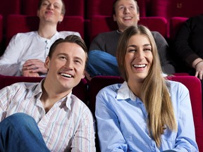 Couple and other people in cinema