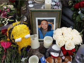 A memorial of flowers and gifts in the 7000 block of California Boulevard N.E. where David Quach, 27, was shot and killed on Saturday, August 22, 2015 in Calgary.