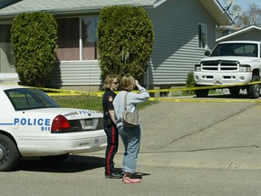 Police at the crime scene in Medicine Hat in 2006.
