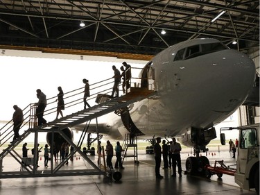 West Jet employees tour the company's new Boeing 767-300 ER aircraft on Thursday August 27, 2015. The wide body long range plane is the first of four the airline is putting into service. The plane is capable of carrying 287 passengers on up to 11 hour flights.
