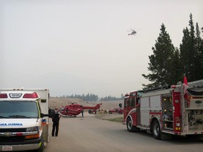 STARS air ambulance and EMS meet the rescue helicopter to transport two patients from the backcountry to hospital.