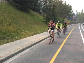 Cyclists on a new dedicated bike lane in the Town of Banff. It's being piloted for a couple of months to see how it works.