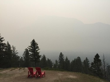 BANFF: Not much of a view from the red chairs on Tunnel Mountain in Banff National Park on Tuesday. A special air quality statement is in effect for much of southern Alberta. Photo: Colette Derworiz/Calgary Herald