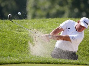 Phil Mickelson of the United States plays a bunker on the first hole during the third round of The Barclays at Plainfield Country Club on August 29, 2015 in Edison, New Jersey.