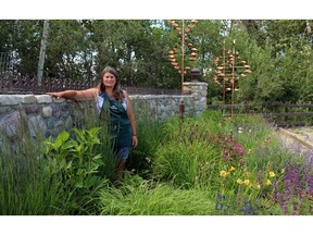 Katrina Diebel, owner of Vale's Greenhouse, stands in her garden, which is built for the Alberta winds.