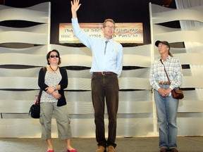 Provincial Liberal leader Dr. David Swann addresses the annual Farmworkers Day BBQ at the Calgary Rehabilitation Centre Thursday August 20, 2015. On the left is Lorna Chandler, whose husband died in a farm accident nine years ago in Black Diamond. On the right is Darlene Dunlop of the Farmworkers Union  of Alberta.