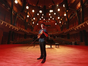 Violinist Timothy Chooi stands in Mount Royal University's Bella Concert Hall in the new Taylor Centre for the Performing Arts on August 25, 2015. The $90.5-million facility is set to officially open tomorrow.