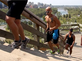 Arjay Aquino works up a hot sweat as he runs up the McHugh Bluff steps above Memorial Drive Monday August 10, 2015. The weather is expected to stay hot all week.