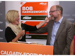 Alberta Premier Rachel Notley and Bob Hawkesworth are all smiles as they greet NDP supporters at Hawkesworth's campaign office on August 17.