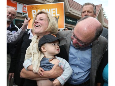 Alberta Premier Rachel Notley  holds up 11 month Addilyn Bishop with Bob Hawkesworth to a large group of NDP supporters at Bob Hawkesworth's campaign office, 45 Edenwold Drive N.W. that opened Sunday afternoon.