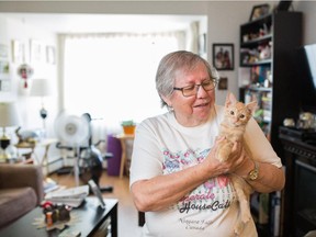 Louise Slade and her kitten Samantha  in their home at the Bow Centre Housing Society in August.