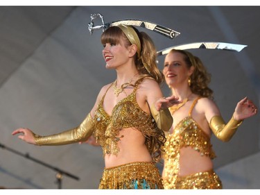Nadia Brante (foreground) and Heather Arnot perform an Egyptian sword dance at GlobalFest Saturday night on the main stage.