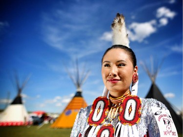 Carly Weasel Child, from Siksika Nation and the 2014 Calgary Stampede Indian Princess,  before competing in the women's jingle dance at the Siksika Nation Fair Powwow.