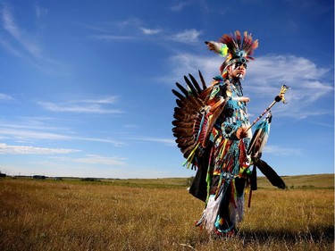 Harland Smalleyes, 21, from Stoney Nakoda First Nation, competes in the junior men's traditional dance during the Siksika Nation Fair Powwow.