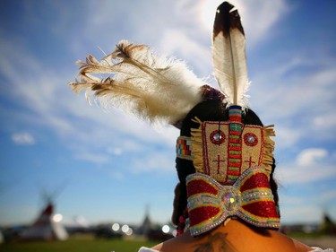 Sahvanne Weasel Traveller, from the Piikanni Nation and the 2010 Calgary Stampede Indian Princess, shows off the intricate beadwork and feathers in her hair before competing in ladies traditional dance at the Siksika Nation Fair Powwow.