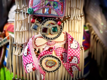 Sahvanne Weasel Traveller's regalia on her traditional dance dress shows her love for Hello Kitty.