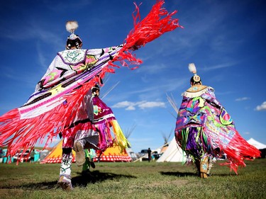 Young fancy dancers practise before competing at the Siksika Nation Fair Powwow.