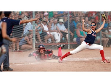 Gators Sadie Scapinello was hoping for a different call as the ump declares Renegades Kate Ferguson safe at first base. It took 11 innings instead of seven but the White Rock Renegades 99 finally earned the final of U16 Girls Fastpitch Canadian Championship over the Guelph Gators. They were down 4-1 at one point in the game.