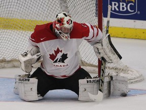 Team Canada goalie Mason McDonald blocks the puck in the opening game of the World's Junior Showcase at the Markin MacPhail Centre in Calgary on Monday. The Calgary Flames prospect has turned plenty of heads among Hockey Canada's brass and could be wearing Red and White at Christmas.
