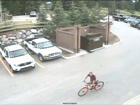 Police released this photo of a suspect on a bicycle in relation to a child luring, assault case in Canmore on Aug. 6, 2015.