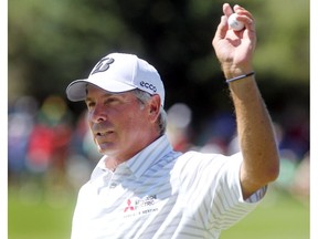 Champions Tour player Fred Couples saluted the crowd after sinking his putt on the 18th green during the second round of the Shaw Charity Classic at the Canyon Meadows Golf and Country Club on August 7, 2015. Couples finished the day with a score of minus 8.