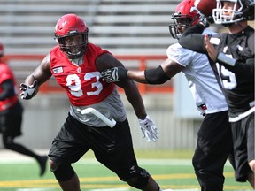 Stampeders defensive lineman Micah Johnson keeps his eye on quarterback Bo Levi Mitchell as the team prepares for Saturday's game against the Riders in Regina.