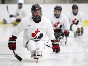 Forward Greg Westlake pushes himself down the ice during a training session earlier this week at the Canadian National Sledge Team development camp at Winsport.