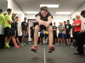 Calgary Hitmen prospect Mark Kastelic performs a broad jump test during the Calgary Hitmen rookie fitness testing at the Scotiabank Saddledome on Thursday.