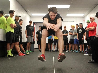 Forward Mark Kastelic, 16, did the broad jump test during the Calgary Hitmen rookie fitness testing at the Scotiabank Saddledome on August 27, 2015.